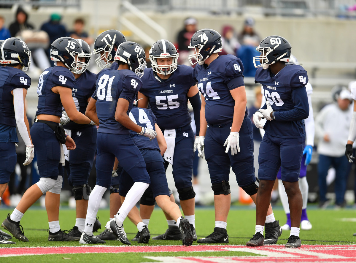 Smithson Valley huddles during the 2022 UIL state playoffs. 